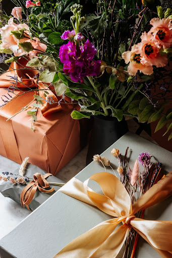 Beautifully wrapped gifts, surrounded with flowers