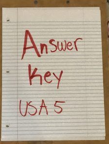 Piece of paper that says answer key in red marker