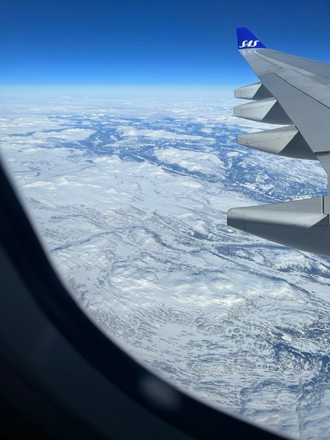 Photo of glaciers out of an airplane window view.