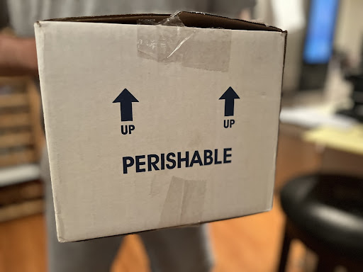Photo of a box that says perishable.