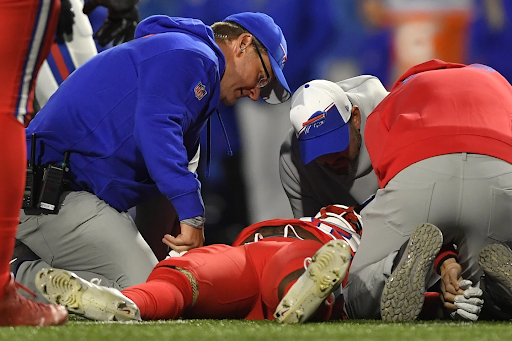 Damien Harris on the field with paramedics. From ap news
