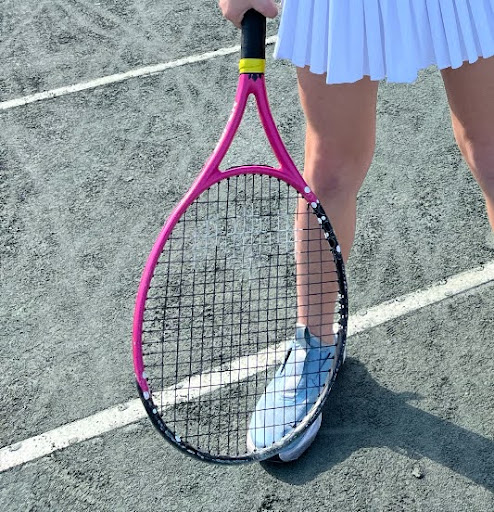 Girl holding a tennis racket

