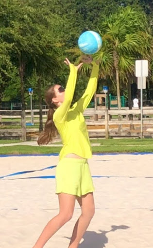  A girl setting a ball.