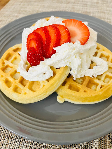 Picture of waffles with strawberries and whipped cream