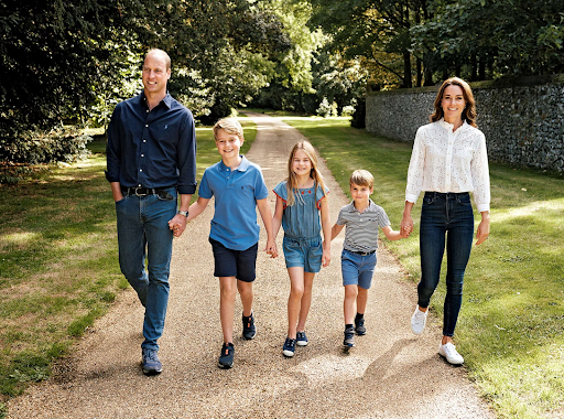 This is a picture of Kate with her husband William and her kids—photo from apnews.com.