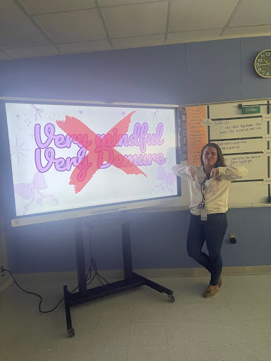 A picture of Mrs. Straiton with a "Very Mindful, Very Demure" sign.