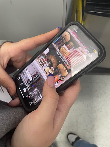 Someone scrolling on their TikTok For You Page