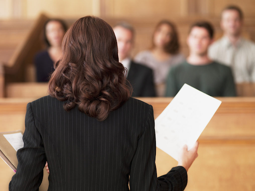 Photo of a lawyer giving a speech.
Photo credit: thedefenders.net