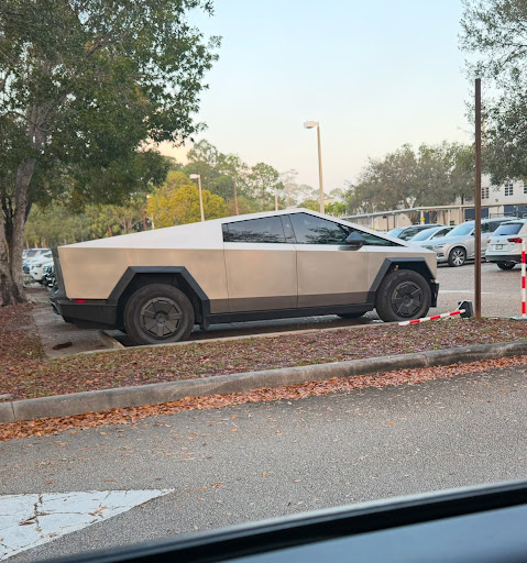 Picture of a gold Tesla Cybertruck.