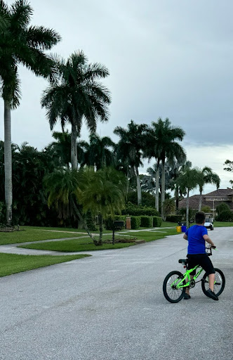 A boy exercising on a bike