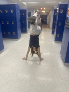 Photo of Student Elise Rubenstein doing a gymnastics stunt.