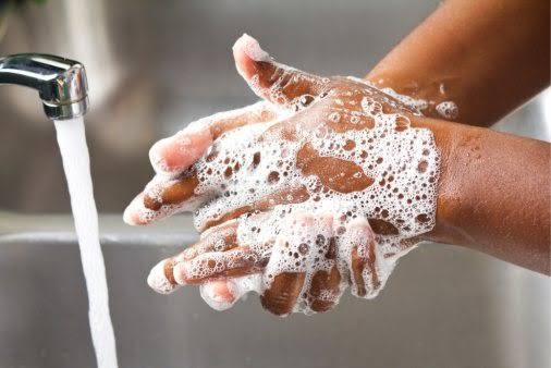 Image of person washing hands 