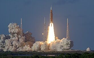 Orion spacecraft and Space Launch System launching.