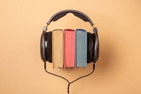 Photo from make use of depicting books with a pair of headphones round them.

